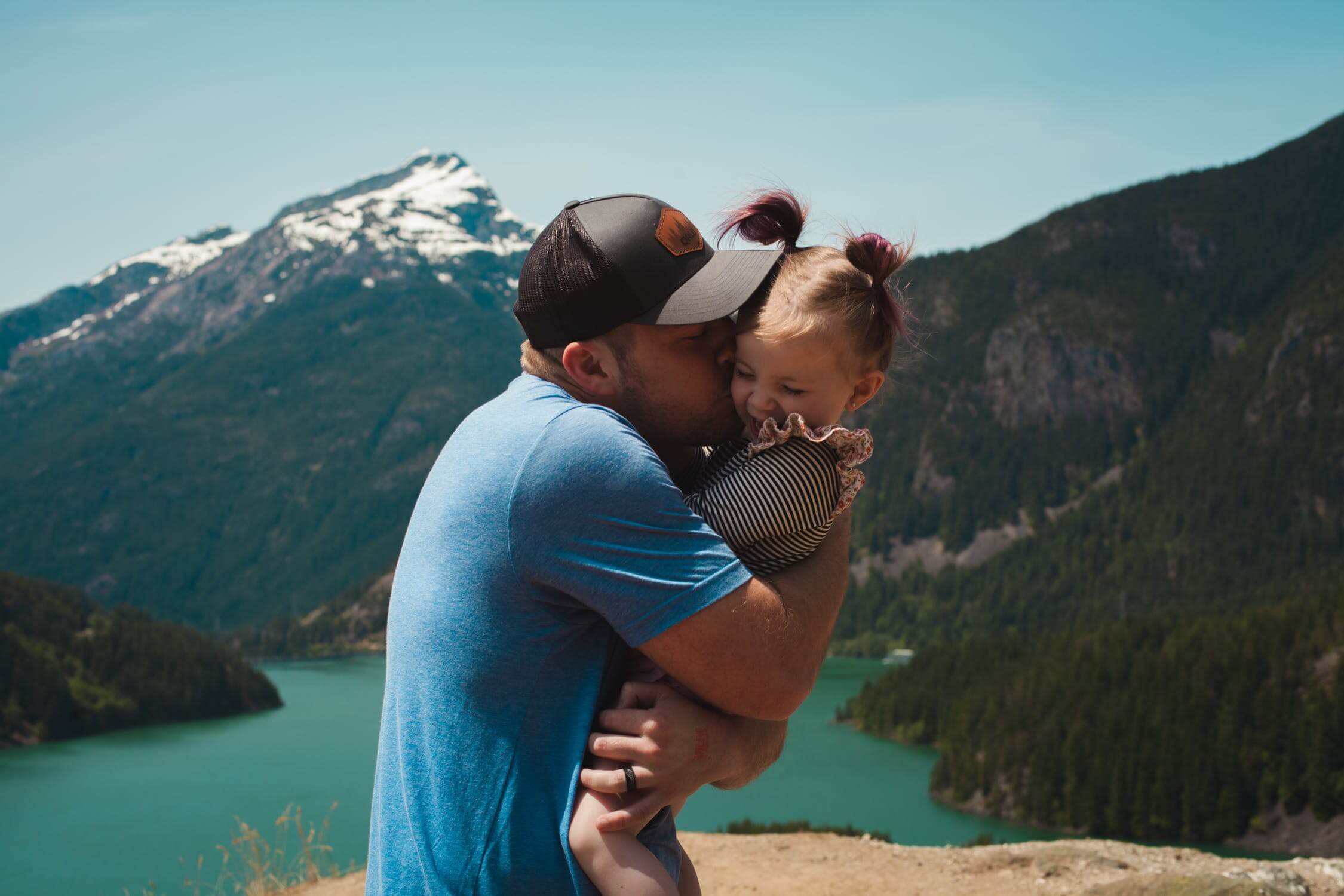 Local Travel Nurse hugging his child while on a local travel contract.