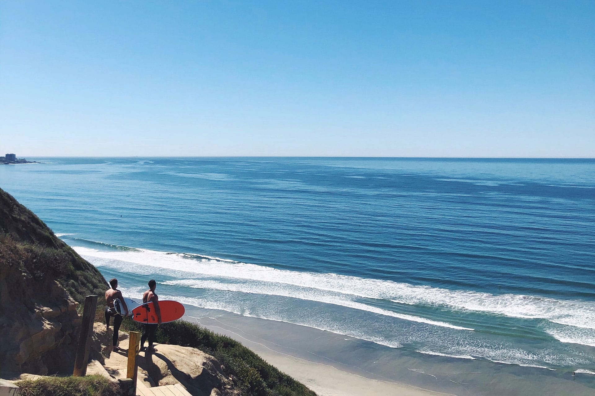 two surfers at black’s beach in Southern California