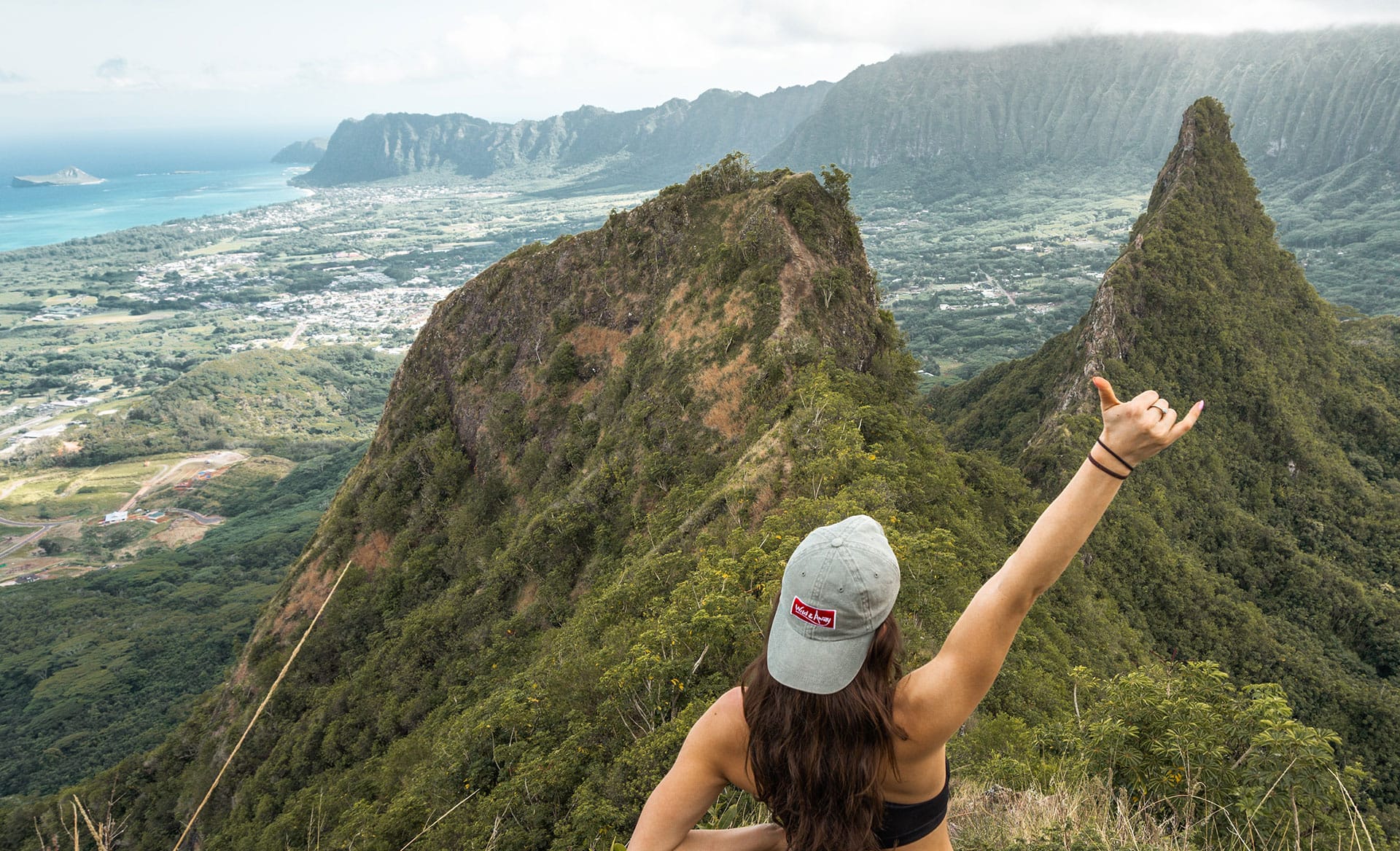 Travel nurse hiking a mountain peak in Hawaii