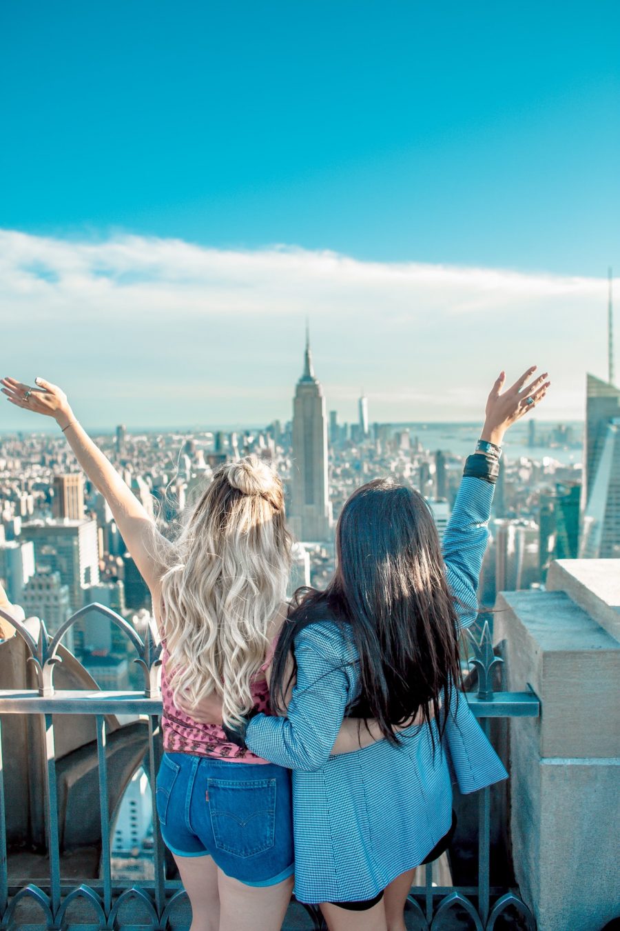 Two friends look out at New York City